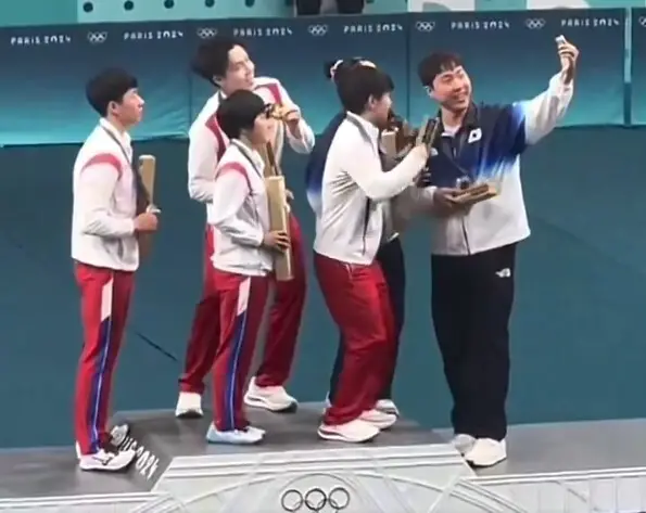 Athletes From North and South Korea Pose Together For Selfie