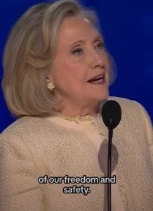 Hillary Clinton Stood And Smiled As DNC Crowd Chants ‘Lock Him Up’