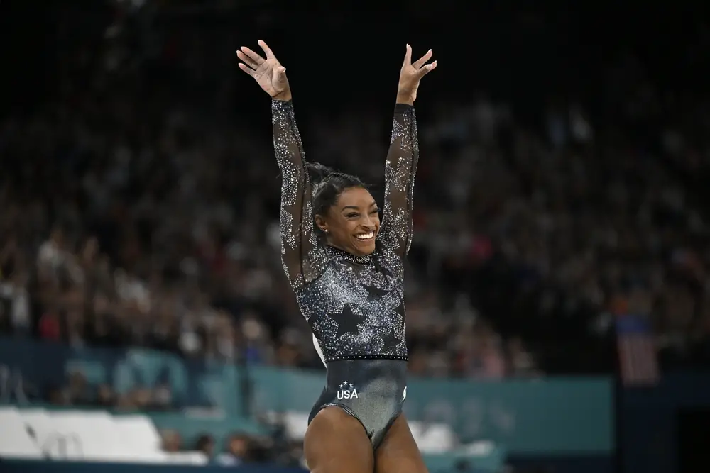 Simone Biles Being Called ‘Greatest Olympic Athlete Of All Time’ After Winning All-Around Gold