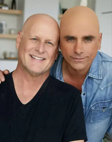 John Stamos Facing Backlash Over Wearing Bald Cap In ‘Solidarity’ With Dave Coulier After Cancer Diagnosis